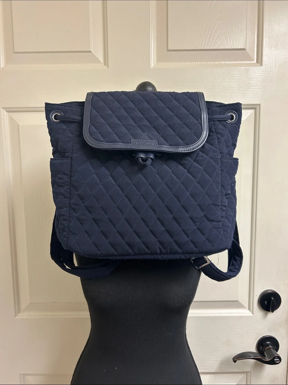 Vera Bradley quilted backpack in navy blue, diamond pattern a front flap closure